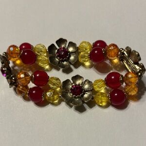 AJABSFH beaded stretch bracelet w/red yellow bead silver tone floral rinestones